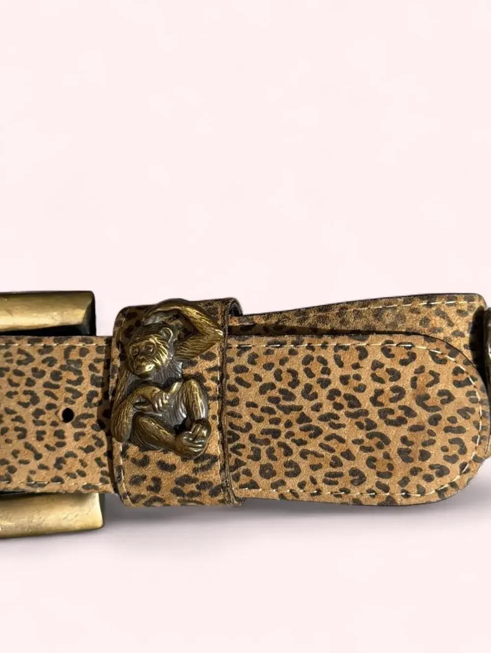 Leopard print western belt with animal accents throughout and chunky buckle!